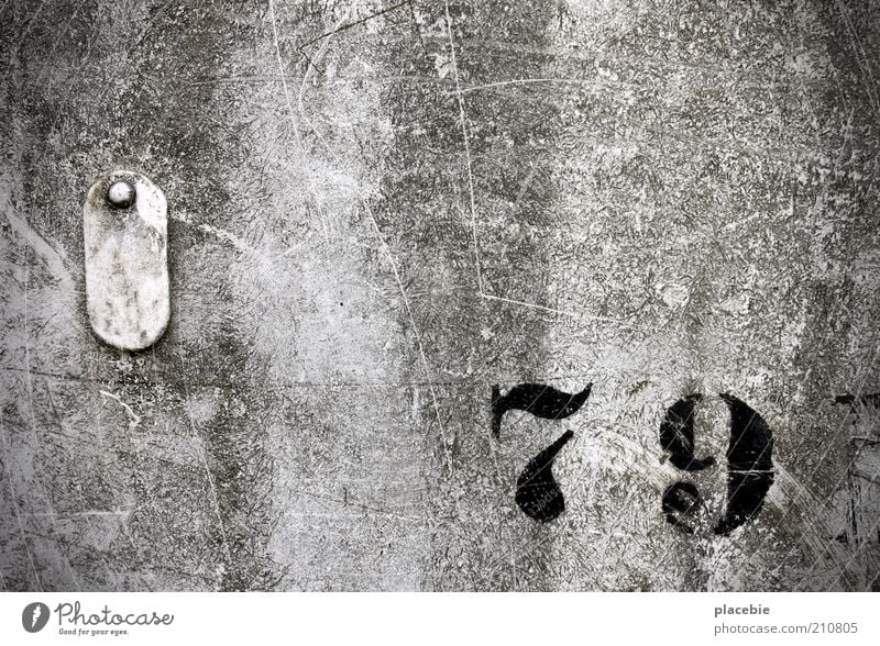 seventy-nine Wall (barrier) Wall (building) Decoration Sign Digits and numbers Signs and labeling Old Dirty Gray Black Exterior shot Deserted Day 79 Decline