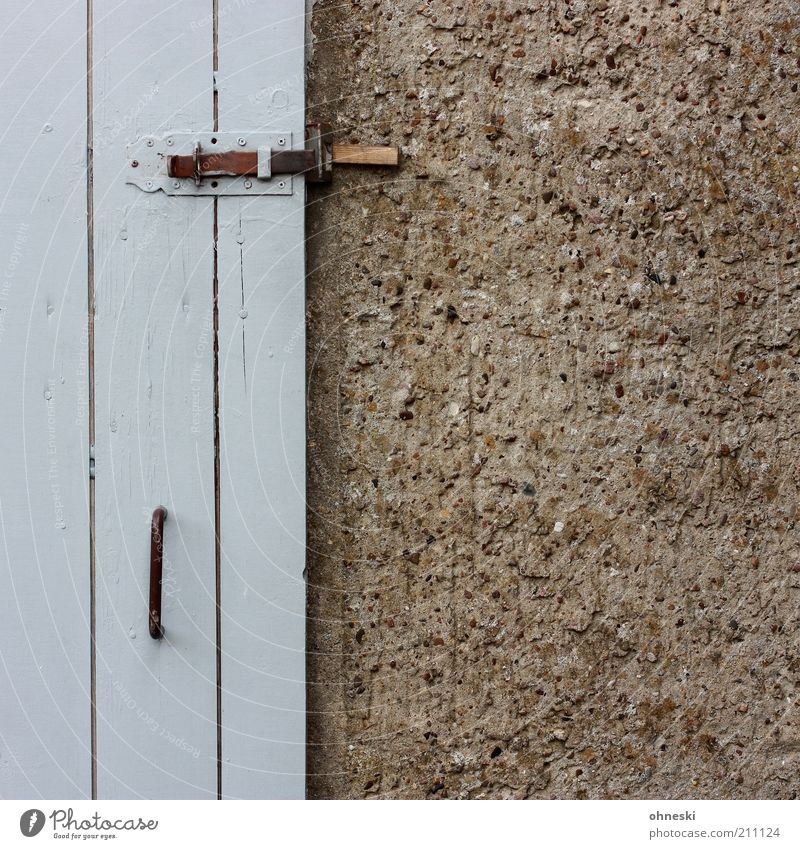 sheds Hut Building Barn Wall (barrier) Wall (building) Facade Door Gray Lock Door handle Subdued colour Exterior shot Copy Space right Detail Wooden door