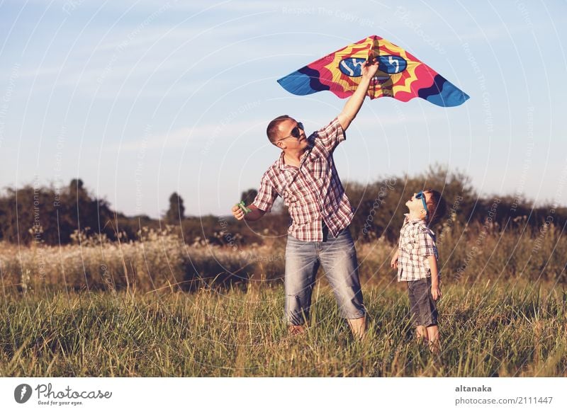 Father and son playing in the park at the sunset time. Lifestyle Joy Happy Leisure and hobbies Vacation & Travel Adventure Freedom Camping Summer Sun Hiking