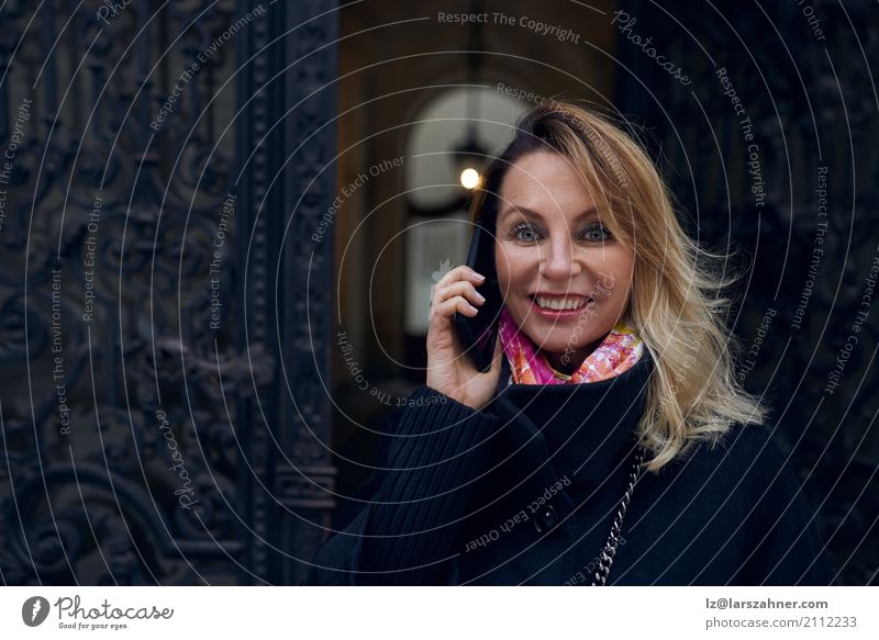 Woman standing in an ornate historic doorway Style Happy Winter House (Residential Structure) Business Telephone PDA Adults 1 Human being 30 - 45 years Coat