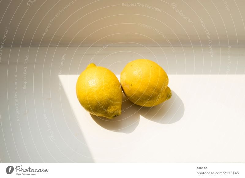 Two lemons in the sunlight on a windowsill Lemon Lemons Citrus fruits Still Life Light Sunlight Shadow Shadow play Contrast Fruit Food Fresh Art naturally