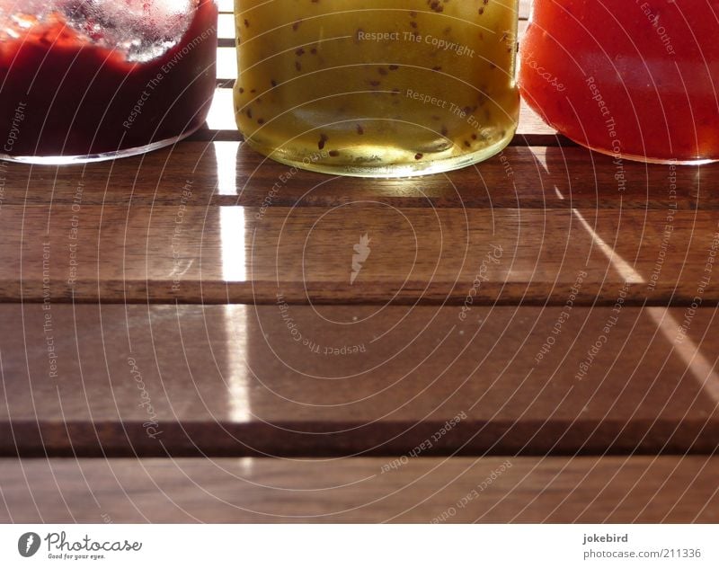 breakfast combo Food Jam Nutrition Table Wood Glass Brown Green Red Conserve Canned Supply Gelatin Sweet Jam jar Colour photo Exterior shot Deserted