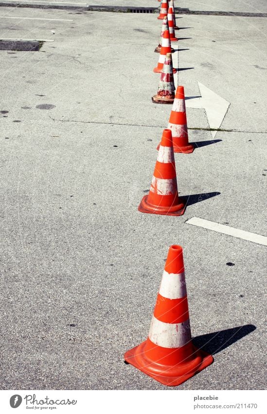 Carefully dance your way out of line Deserted Street Gray White Transport Places Conical Construction site Warning label Bans Asphalt Orange Warning sign