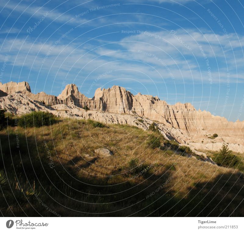 Creeping Shadow Landscape Sky Clouds Sunlight Summer Beautiful weather Warmth Grass Rock Mountain Badlands Dry Willpower Dependability Endurance Unwavering