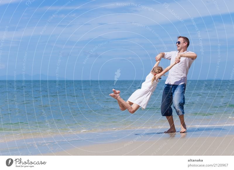 Father and daughter playing on the beach at the day time. Lifestyle Joy Relaxation Leisure and hobbies Playing Vacation & Travel Trip Freedom Summer Sun Beach