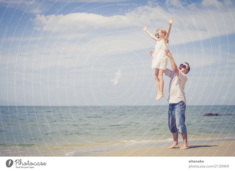 Father and daughter playing on the beach at the day time. Lifestyle Joy Relaxation Leisure and hobbies Playing Vacation & Travel Trip Freedom Summer Sun Beach