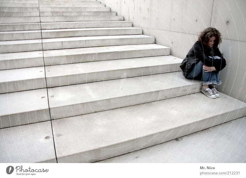 solitude Feminine Woman Adults Manmade structures Wall (barrier) Wall (building) Stairs Curl Black Calm Sadness Concern Lovesickness Longing Loneliness