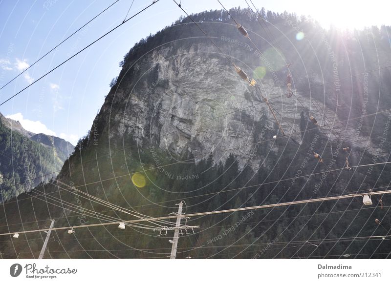 Nature and technology Landscape Earth Sky Clouds Sun Sunlight Summer Forest Rock Alps Peak Large Homesickness Mountain Railroad system Electricity