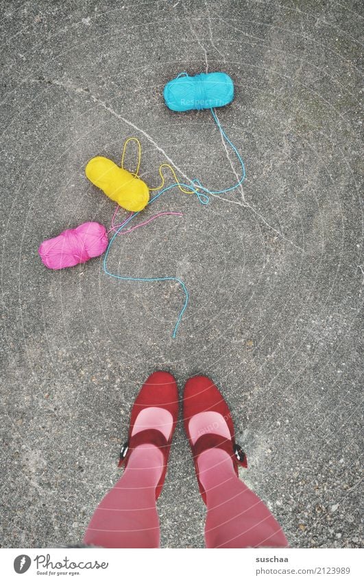 lost the thread ... Wool Ball of wool Handcrafts 3 Cyan Magenta Yellow Multicoloured Street Asphalt feet Legs Stand Footwear Red Fall down Doomed Surrealism