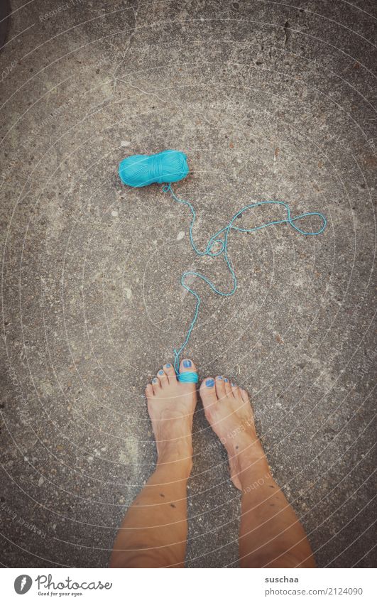 thread (tied) String unwound Wool Ball of wool Handcrafts Wrapped around tethered feet Legs Toes Stand Blue Barefoot Asphalt Surrealism Shackled Fetishism