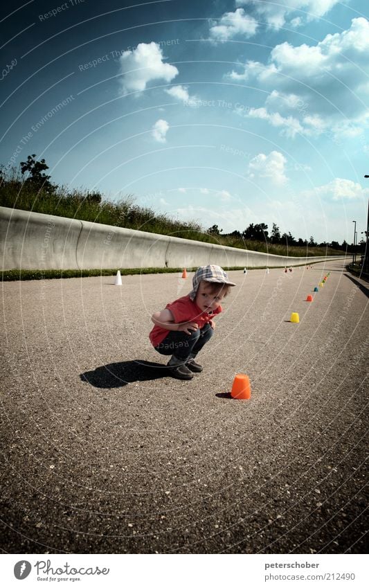 referee Playing Summer Fan Sporting event Child Toddler Boy (child) Infancy 1 Human being 1 - 3 years Clouds Street Concrete Discover Crouch Gray Anticipation