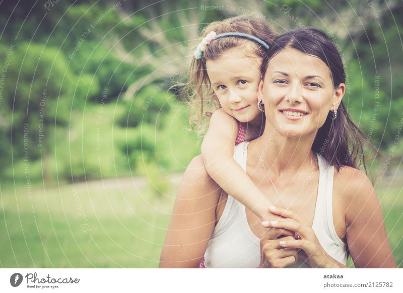 Happy mother and daughter playing in the park Lifestyle Joy Beautiful Face Leisure and hobbies Playing Summer Child Human being Baby Woman Adults Parents Mother