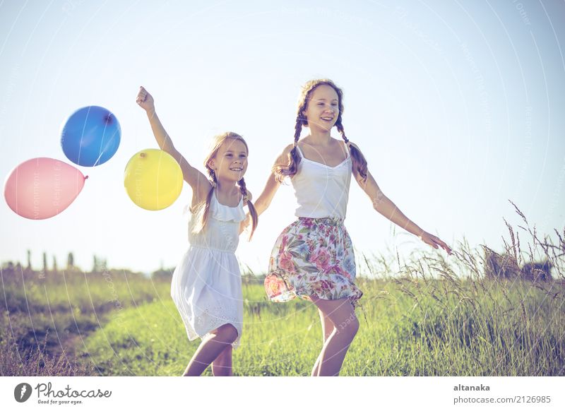 Happy little children playing in the field at the day time. Lifestyle Joy Leisure and hobbies Playing Vacation & Travel Trip Adventure Freedom Camping Summer