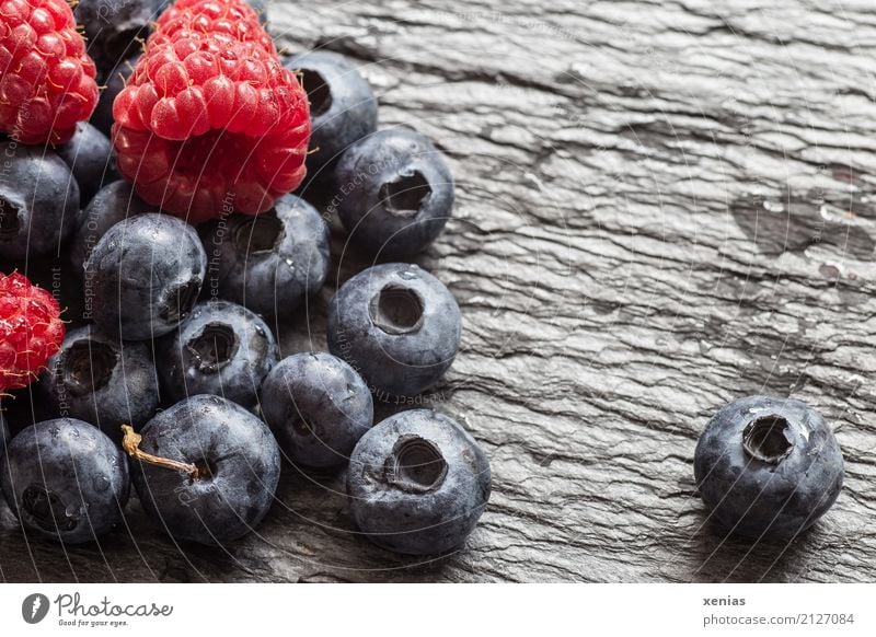 Blue and raspberries on slate plate Fruit Blueberry Raspberry Organic produce Vegetarian diet Healthy Summer Autumn Stone Juicy cute Red Black Slate Vitamin