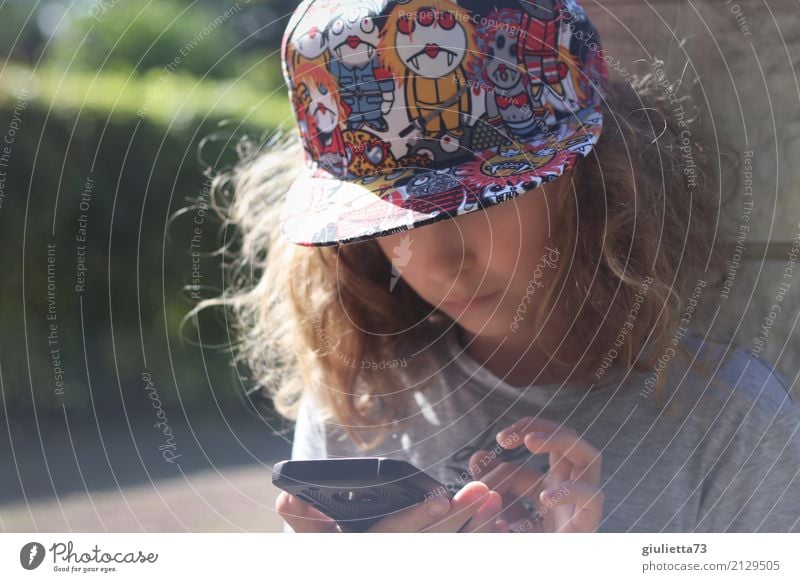 Generation Z | child with cool cap and engrossed in his mobile phone Leisure and hobbies Playing Computer games Masculine Child Boy (child) Infancy Life 1