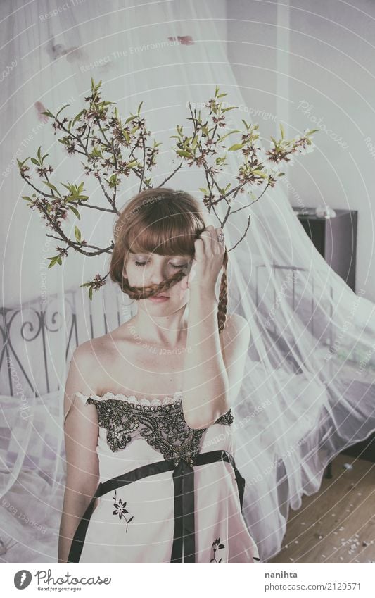 Young woman in her room with tree branches over her head Elegant Style Beautiful Harmonious Relaxation Calm Dream house Interior design Bed Bedroom Human being