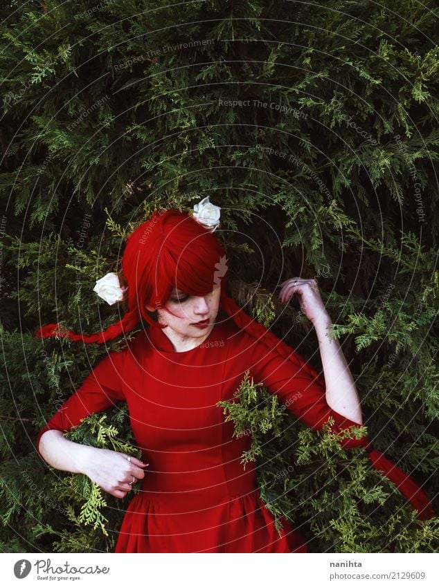 Young woman with red hair and red dress lying on leaves Style Design Human being Feminine Youth (Young adults) 1 18 - 30 years Adults Art Work of art Flower