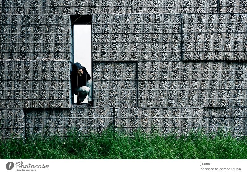 THE OTHER SIDE Man Adults 1 Human being Meadow Wall (barrier) Wall (building) Think Sadness Cry Sharp-edged Gloomy Gray Green Emotions Protection Grief Pain