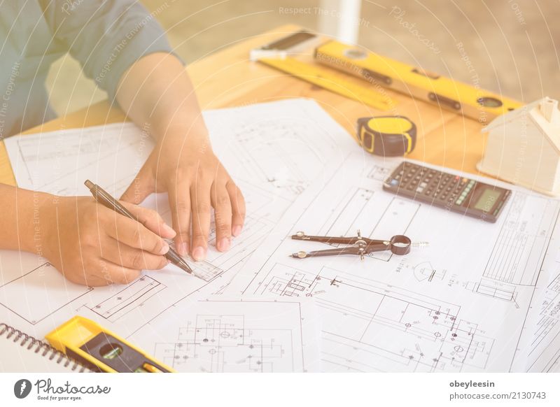 Architect or planner working on drawings for construction Design Desk Work and employment Profession Office Business Meeting Computer Notebook Technology