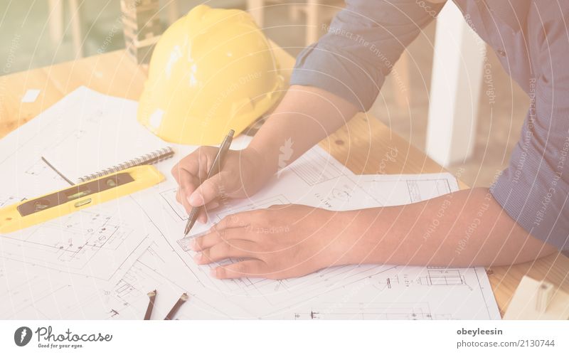 Architect or planner working on drawings for construction Design Desk Work and employment Profession Office Business Meeting Computer Notebook Technology