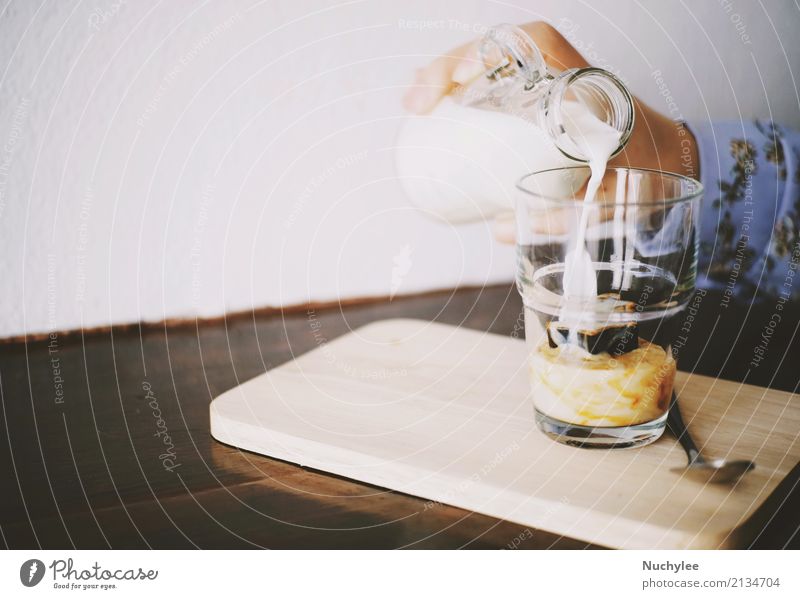 Hand pouring milk to glass on iced espresso with copy space frozen soft drink cocktail cafe coffee summer cold table caffeine brown simple refreshment