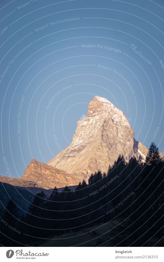 Matterhorn V Mountaineering Climbing Hiking Environment Nature Landscape Cloudless sky Beautiful weather Alps Peak Zermatt Switzerland Europe Blue Gold Power