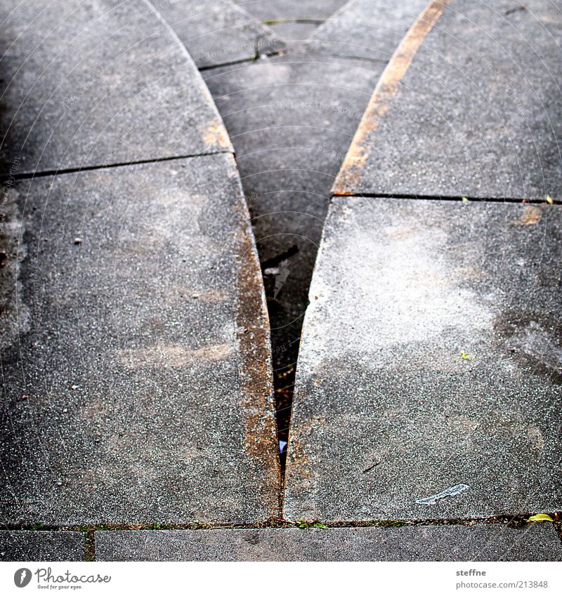 [H10.1] V-neck Lanes & trails Stone Concrete Orange Gray Silver Subdued colour Exterior shot Detail Copy Space left Copy Space right Day Shallow depth of field