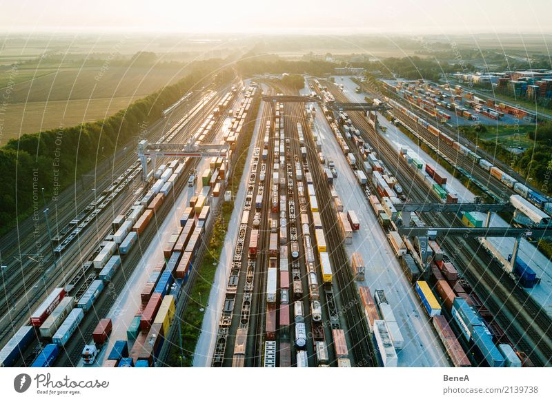 Freight trains and freight containers in a container terminal Economy Industry Trade Logistics Business Technology Advancement Future Transport