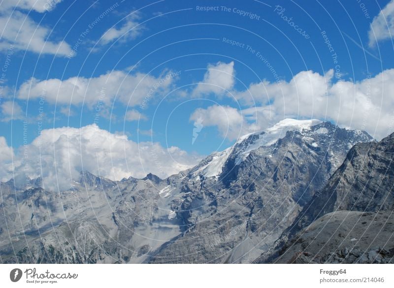 BLUE MONTAGUE Environment Nature Landscape Air Sky Clouds Summer Beautiful weather Rock Alps Mountain Peak Snowcapped peak Stone Exceptional Blue Gray White