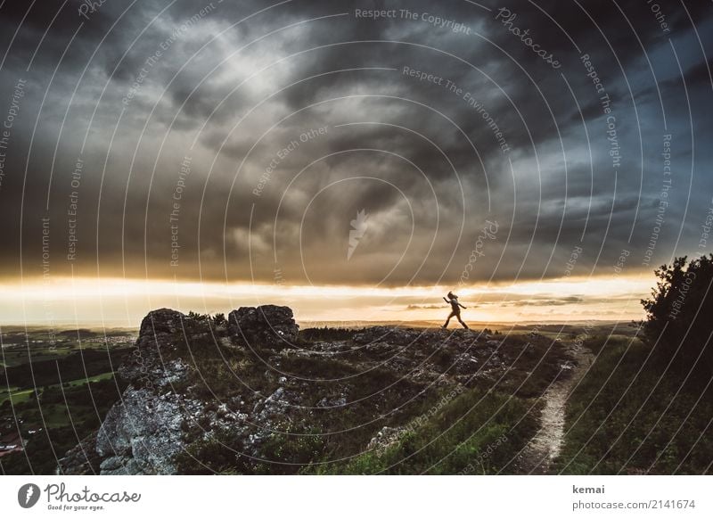 In the face of the storm. Adventure Far-off places Freedom Life 1 Human being Environment Nature Landscape Sky Storm clouds Summer Weather Hill Rock Mountain