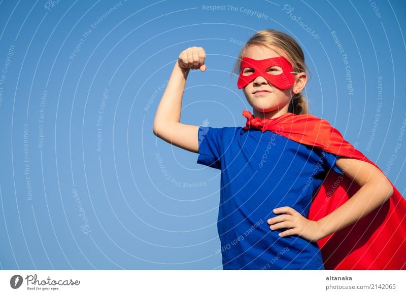 Happy little child playing superhero. Kid having fun outdoors. Concept of girl power. Lifestyle Joy Beautiful Playing Vacation & Travel Adventure Freedom Summer