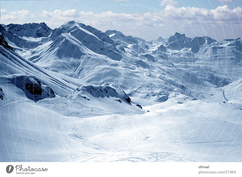 Arlberg Clouds Vacation & Travel Panorama (View) Winter Mountain Snow Sun Sky Alps Far-off places Valley Tracks Rock Large Ski run Ski resort Ski-run