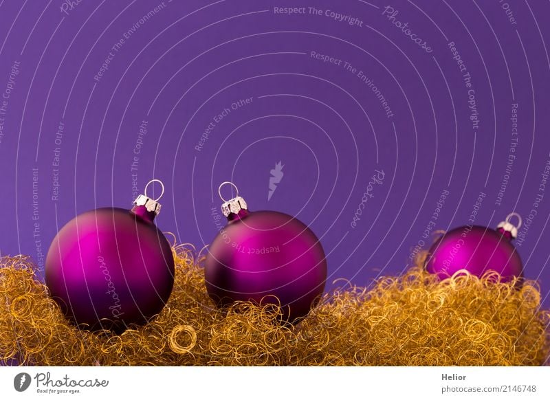 Violet Christmas balls on purple background with gold tinsel Design Joy Feasts & Celebrations Christmas & Advent Glass Metal Sphere Round Gold Anticipation