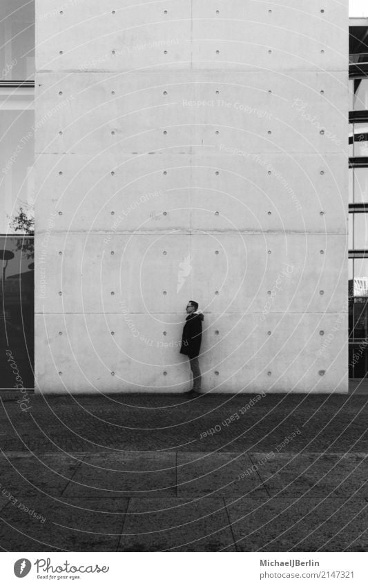 Man standing on a wall Masculine Young man Youth (Young adults) 1 Human being 18 - 30 years Adults Capital city Wall (barrier) Wall (building) Jacket Stand