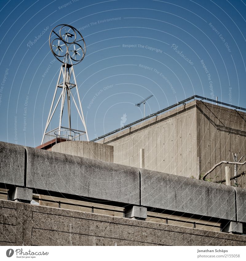 some concrete stuff in London Town Outskirts Skyline Industrial plant Factory Facade England Great Britain Pinwheel Air speed meter Concrete Blue sky Roof