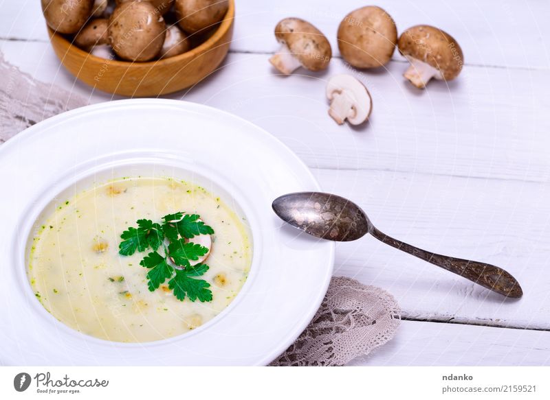 Cream mushroom soup of fresh champignons Vegetable Fruit Soup Stew Dinner Vegetarian diet Diet Plate Spoon Wood Fat Fresh Hot Above Brown White Slice Vegan diet