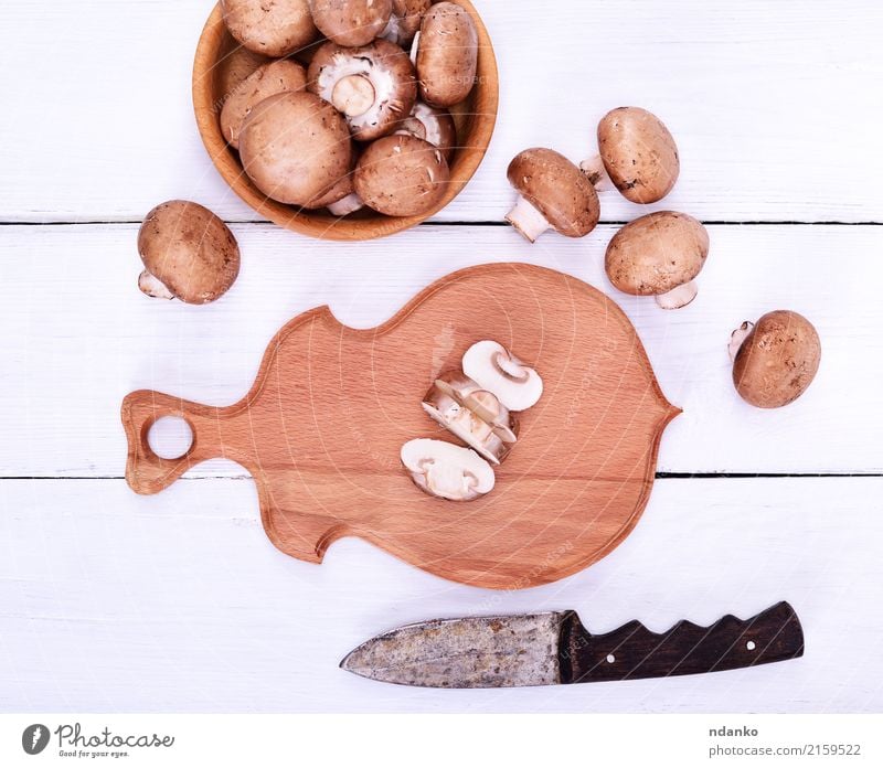 Fresh mushrooms champignons Food Vegetable Vegetarian diet Bowl Knives Kitchen Wood Brown White Champignon Mushroom board knife Top background Edible Raw whole