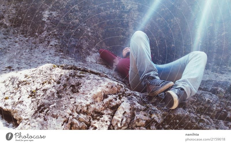 Young man lying down on a rock Lifestyle Vacation & Travel Tourism Adventure Freedom Expedition Human being Masculine Youth (Young adults) 1 18 - 30 years