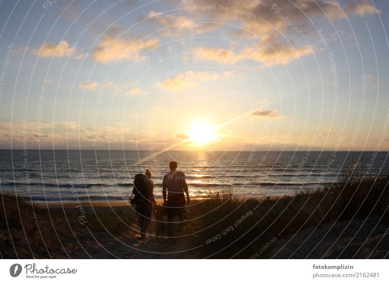 Father, mother and child walking in the evening sun through a beach dune Happy Parents Vacation & Travel Freedom Summer Summer vacation Ocean parenthood