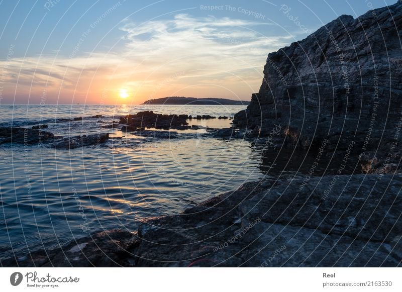 Sunset by the sea Nature Landscape Water Sky Sunrise Summer Rock Coast Ocean Mediterranean sea Vacation & Travel Blue Orange Rocky coastline Stone Croatia