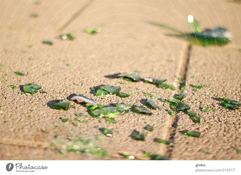 beer break Sidewalk Glass Broken Green Shard Bottle Label Colour photo Exterior shot Detail Deserted Day Light Blur Shallow depth of field Worm's-eye view