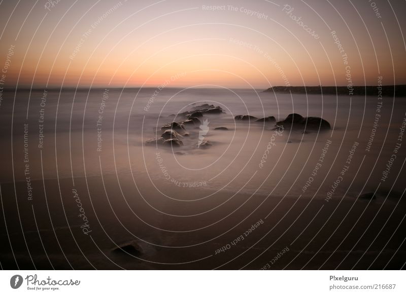 swimming lake Sand Water Cloudless sky Sunrise Sunset Sunlight Summer Rock Coast Beach Ocean Loneliness Senses Colour photo Exterior shot Experimental Deserted