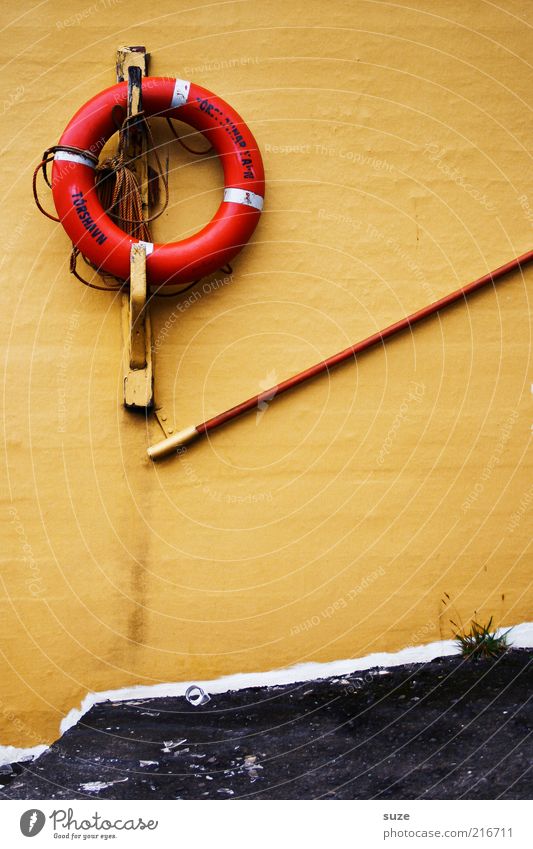 Torshavn Decoration Characters Old Yellow Rescue Føroyar Life belt Wall (building) Handrail Tórshavn Lifesaving Colour photo Multicoloured Exterior shot