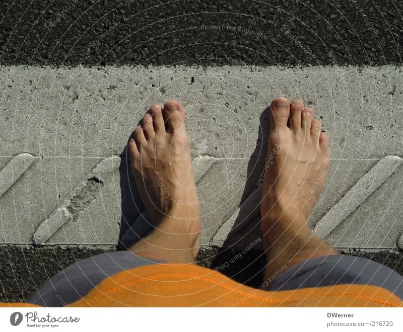 stand Human being Masculine Man Adults Legs Feet 1 Pants Stone Stand Wait Stagnating Asphalt Barefoot Summer Lane markings Colour photo Exterior shot Detail