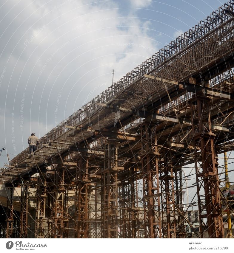 bridge building Human being Masculine 1 Bridge Manmade structures Brown Steel Construction site India Colour photo Subdued colour Exterior shot