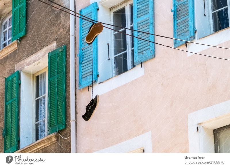 Shoes, power line, houses Life Summer House (Residential Structure) Beautiful weather Small Town Downtown Old town Marketplace Building Wall (barrier)