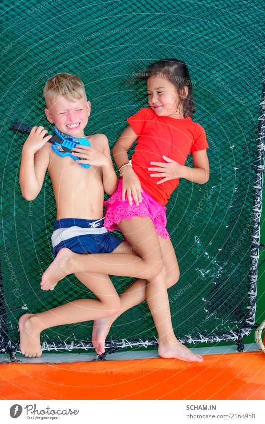 Cute kids on a boat trip. Boy is playing a toy guitar for his beautiful girlfriend Lifestyle Joy Vacation & Travel Trip Adventure Freedom Summer Island