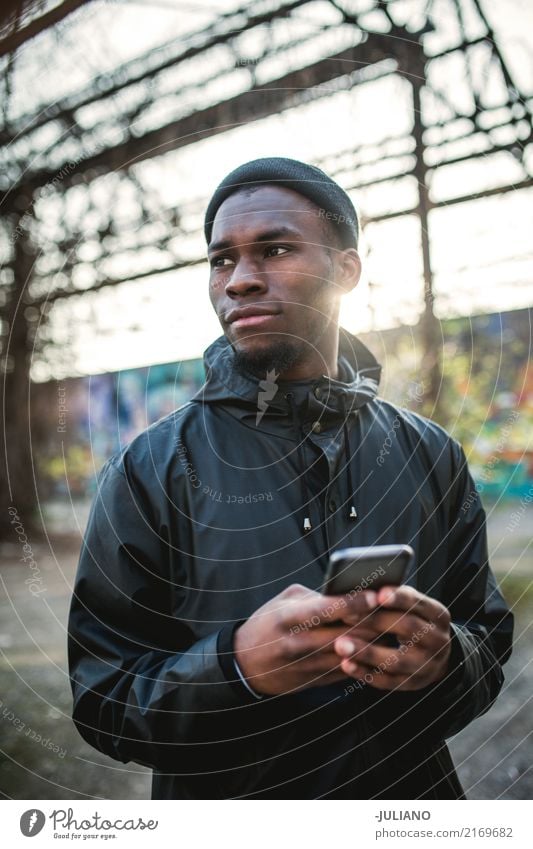 young man is holding smartphone at urban place Lifestyle Leisure and hobbies Vacation & Travel Telecommunications Cellphone Advancement Future