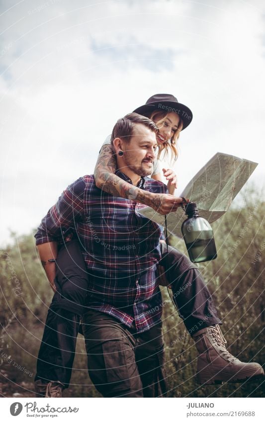 hiking couple doing piggyback while checking the route on map Bottle Leisure and hobbies Vacation & Travel Trip Adventure Freedom Expedition Camping Mountain