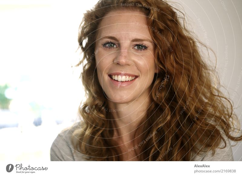 young beautiful redhead woman with curls and freckles smiles at camera Style Happy pretty Face Young woman Youth (Young adults) Freckles pit 18 - 30 years